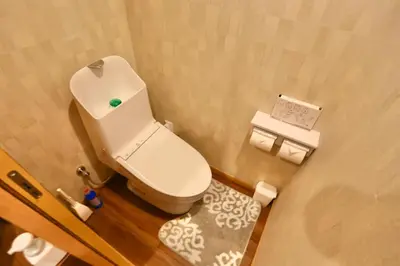 a small bathroom with a white toilet in a room at New 2BR Ueno Home 2 Minutes Walk to Metro Station in Tokyo
