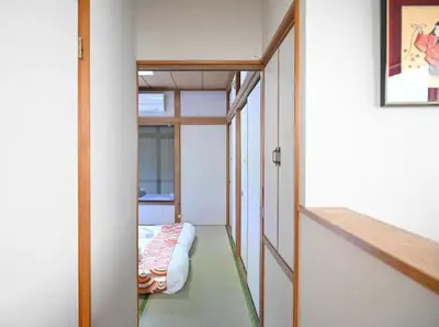 a small bedroom with a bed in a room at Two bathrooms, two toilets 6 mins walking distance from Keisei Takasago Station in Tokyo