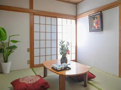 a room with a table and a vase on it at Two bathrooms, two toilets 6 mins walking distance from Keisei Takasago Station in Tokyo
