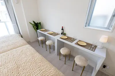 a bathroom with a counter with stools and a sink at LIVCITY Kinshicho 801 in Tokyo