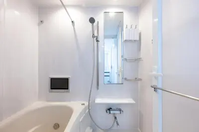 a white bathroom with a tub and a sink at LIVCITY Kinshicho 801 in Tokyo