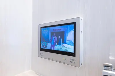 a flat screen tv hanging on a wall at LIVCITY Kinshicho 802 in Tokyo