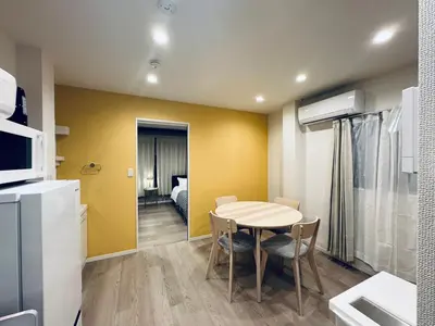 a kitchen and dining room with a table and chairs at Higashiasakusa house 1F-TT0365 in Tokyo