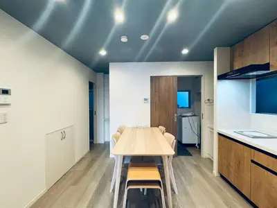 a dining room with a table and a kitchen at Higashiasakusa House 2-3F-TT0366 in Tokyo