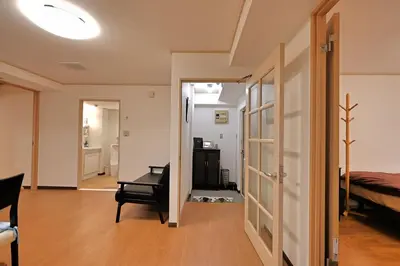 a room with a bed and a chair and a desk at \u30b5\u30f3\u30e9\u30a4\u30d5\u677e\u304c\u8c37 in Tokyo