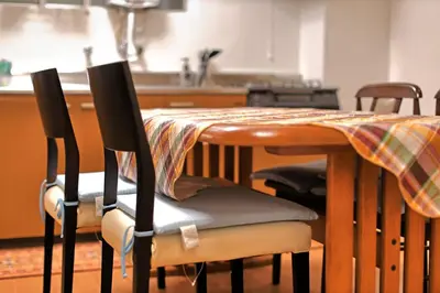 a table with chairs and a table cloth on it at \u30b5\u30f3\u30e9\u30a4\u30d5\u677e\u304c\u8c37 in Tokyo