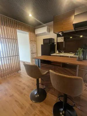 a kitchen with a table and chairs in a room at Quiet residential room 408 walking distance of Shinjuku in Tokyo