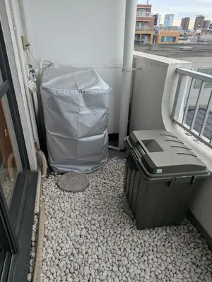 a trash can sitting on a balcony next to a trashcan at Comforting room 410 walking distance of Shinjuku in Tokyo