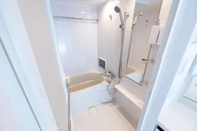 a white bathroom with a tub and a shower at LIVCITY Kinshicho 1102 Skytree view in Tokyo