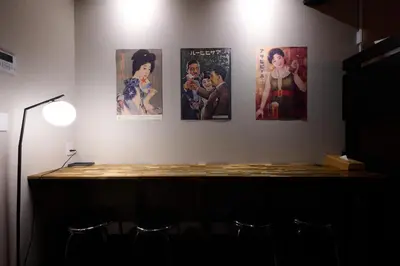 a room with four pictures on the wall at Blossom House Shibuya in Tokyo