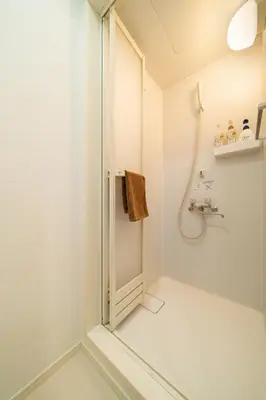 a shower with a glass door in a bathroom at 107, Takasago A,,Entire house for rent \u9ad8\u7802A in Tokyo