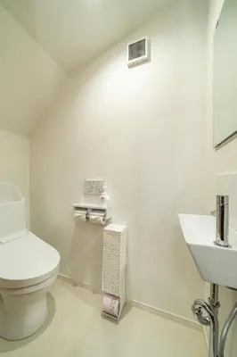 a white bathroom with a toilet and a sink at 107, Takasago A,,Entire house for rent \u9ad8\u7802A in Tokyo