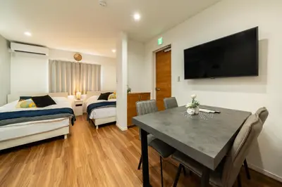 a living room with a dining table and a bedroom at 107, Takasago A,,Entire house for rent \u9ad8\u7802A in Tokyo