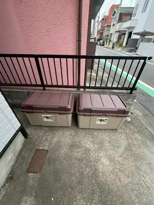 two suitcases sitting under a bench on the sidewalk at 107, Takasago A,,Entire house for rent \u9ad8\u7802A in Tokyo