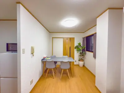 a kitchen with a table and chairs in a room at \u62bc\u4e0ahotel max4 people -SM0385 in Tokyo