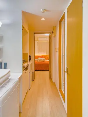 a hallway leading to a bedroom with a bed at \u62bc\u4e0a hotel \u5927\u5e8a\u623f -SM0387 in Tokyo