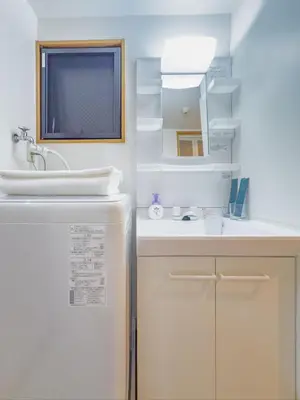 a white bathroom with a sink and a refrigerator at \u62bc\u4e0a hotel \u5927\u5e8a\u623f -SM0387 in Tokyo