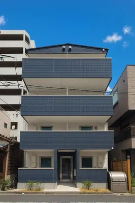 a tall building with a blue facade at \u79cb\u53f6\u539f hotel -TT0379 in Tokyo