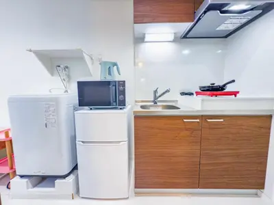 a kitchen with a white refrigerator and a sink at \u79cb\u53f6\u539f hotel -TT0379 in Tokyo