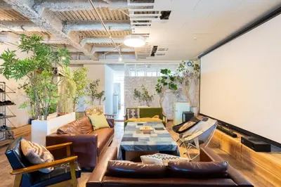 a living room with couches and a table at CREA BASE -Indoor Glamping Retreat- in Tokyo