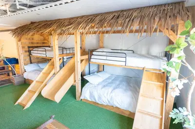 a room with three bunk beds in it at CREA BASE -Indoor Glamping Retreat- in Tokyo