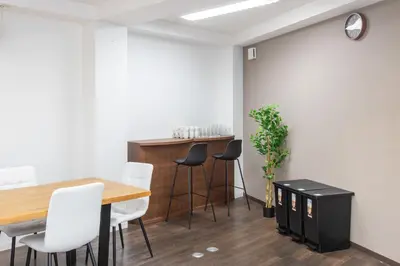 a dining room with a table and chairs at \u5bcc\u4e45\u30b9\u30af\u30a8\u30a2 in Tokyo