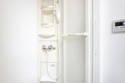 a bathroom with a white toilet in a room at \u5bcc\u4e45\u30b9\u30af\u30a8\u30a2 in Tokyo
