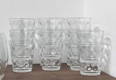 a group of clear glasses sitting on a table at \u5bcc\u4e45\u30b9\u30af\u30a8\u30a2 in Tokyo