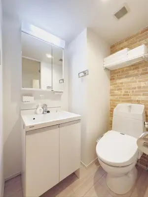 a white bathroom with a toilet and a sink at \u9526\u7cfb\u753a hotel -SM0380 in Tokyo
