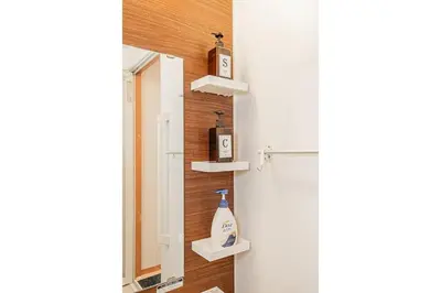 a bathroom with a mirror and a sink at Mori Hotel \u9280\u5ea7 in Tokyo