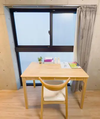 a wooden table with a chair and a window at \u6d45\u8349 ideas hotel \u5927\u5e8a\u623f-TT0390 in Tokyo