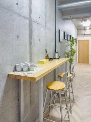 a kitchen with a wooden counter with stools at \u6d45\u8349 ideas hotel max 6 people -TT0392 in Tokyo