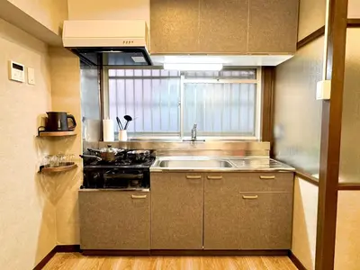 a small kitchen with a sink and a stove at #202 Tokyo Ryogoku Hokusai Katsushika in Tokyo