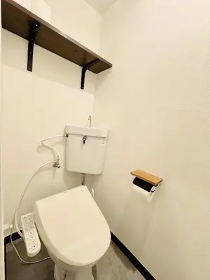 a bathroom with a white toilet with a remote control at #202 Tokyo Ryogoku Hokusai Katsushika in Tokyo