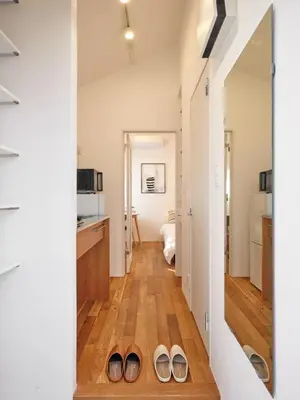 a hallway with two pairs of shoes on the floor at Spacious House for 2people 7min Ohanajaya Sta 14min Skytree 19min Asakusa 20min Ueno Comfortable Stay Tokyo HANACHO \u304a\u82b1\u8336\u5c4b \u3086\u3063\u305f\u308a2\u540d Gato Ohanajaya in Tokyo
