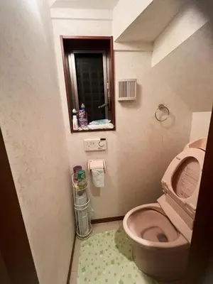 a bathroom with a pink toilet and a window at 2ppl Share House Twin Room with 2 single beds in Tokyo