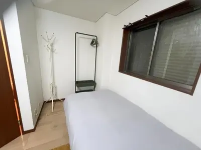 a bedroom with a white bed and a window at 2ppl Share House Twin Room with 2 single beds in Tokyo