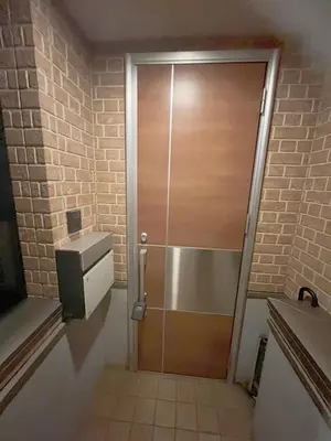 a shower with a wooden door in a bathroom at 2ppl Share House Twin Room with 2 single beds in Tokyo