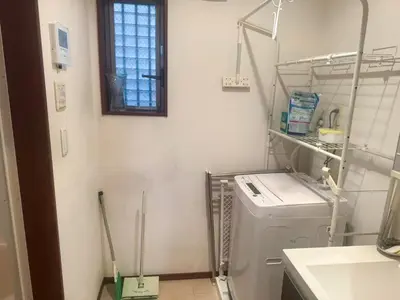 a laundry room with a washing machine and a window at 2ppl Share House Twin Room with 2 single beds in Tokyo