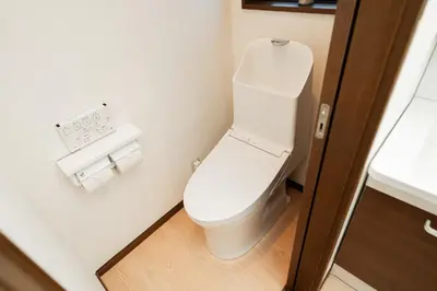 a bathroom with a white toilet in a room at GLOU Shibuya House - A Private House in Tokyo Shinjuku & Shibuya Area in Tokyo
