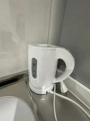 a white cup sitting on top of a toilet at \u65b0\u7bc9OPEN GREW OJI residence101 in Tokyo