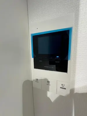 a flat screen tv on a wall in a room at \u65b0\u7bc9OPEN GREW OJI residence101 in Tokyo