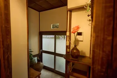 a hallway with a vase with a flower in it at Historic House in Sangenjaya - Central Tokyo Stay in Tokyo