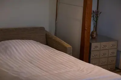 a bedroom with a bed and a dresser at Historic House in Sangenjaya - Central Tokyo Stay in Tokyo