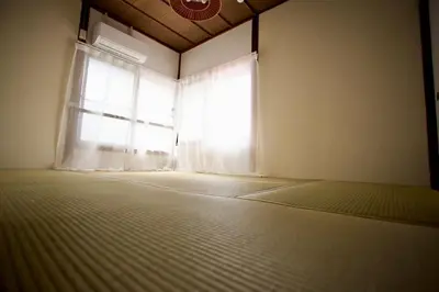 an empty room with a window with a bed in front of it at Historic House in Sangenjaya - Central Tokyo Stay in Tokyo