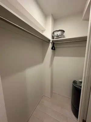 a walk in closet with a shelf on the wall at \u65b0\u7bc9OPEN GREW OJI residence102 in Tokyo
