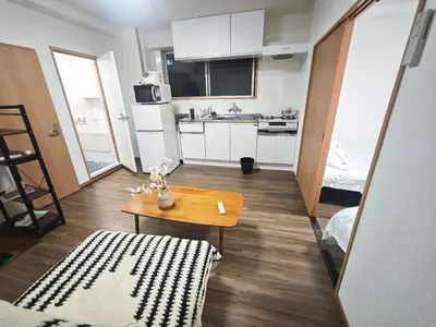 a small room with a table and a kitchen at ZYZ Negishi\u9daf\u8c37\u99c5 TT0257 in Tokyo