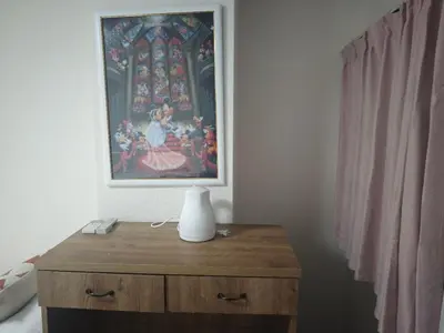 a table with a vase on it with a painting on the wall at ZYZ Negishi\u9daf\u8c37\u99c5 TT0257 in Tokyo
