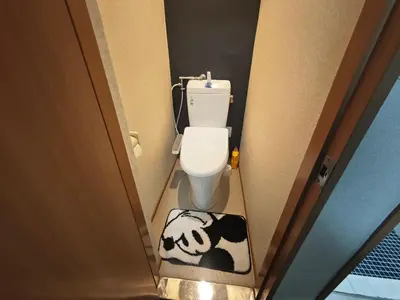 a small bathroom with a toilet with a dog rug at ZYZ Negishi\u9daf\u8c37\u99c5 TT0257 in Tokyo