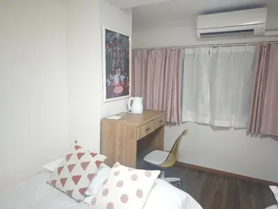 a bedroom with a bed and a desk and a window at ZYZ Negishi\u9daf\u8c37\u99c5 TT0257 in Tokyo